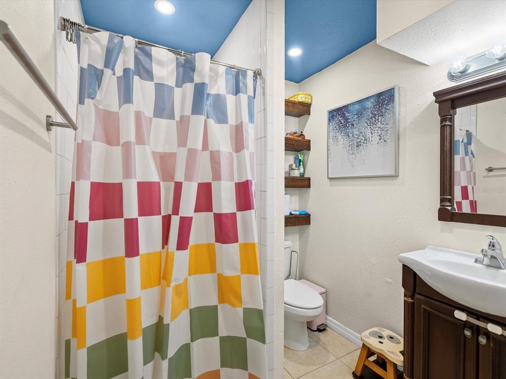 7114 Carlow Street New Port Richey, FL 34653 - Photo 18 of 65 a bathroom with a sink toilet and shower