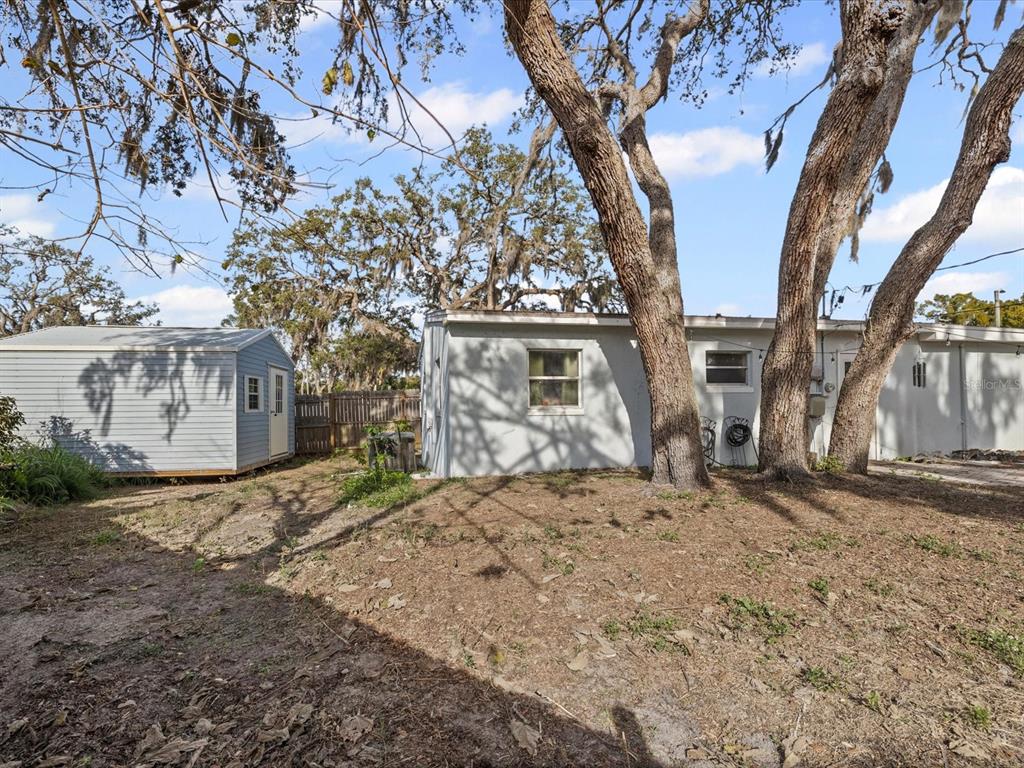 7114 Carlow Street New Port Richey, FL 34653 - Photo 27 of 65 a view of a house with a snow in the yard