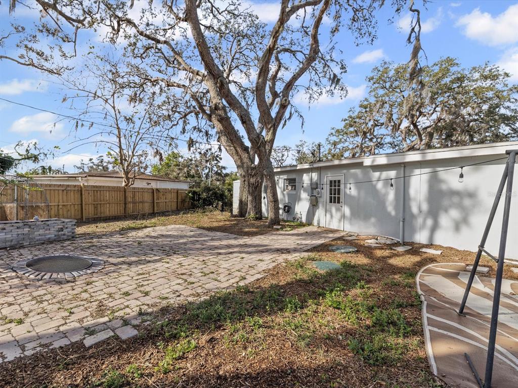 7114 Carlow Street New Port Richey, FL 34653 - Photo 31 of 65 a view of backyard with wooden fence
