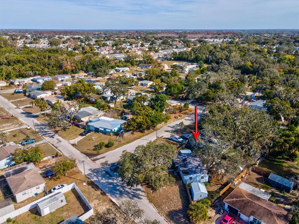7114 Carlow Street New Port Richey, FL 34653 - Photo 43 of 65 an aerial view of a houses and city street