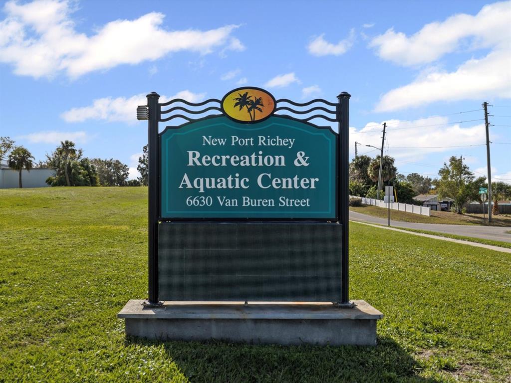 7114 Carlow Street New Port Richey, FL 34653 - Photo 45 of 65 a sign on the side of the building