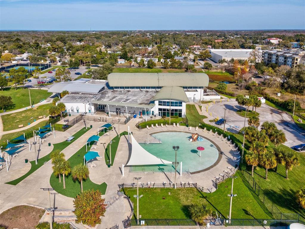 7114 Carlow Street New Port Richey, FL 34653 - Photo 48 of 65 an aerial view of residential houses with outdoor space and swimming pool