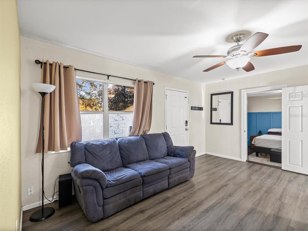 7114 Carlow Street New Port Richey, FL 34653 - Photo 10 of 65 a living room with furniture and a large window