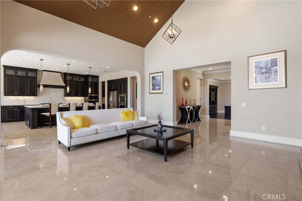 2498 Santa Paula Drive Brea, CA 92821 - Photo 16 of 75 a living room with furniture kitchen view and a flat screen tv