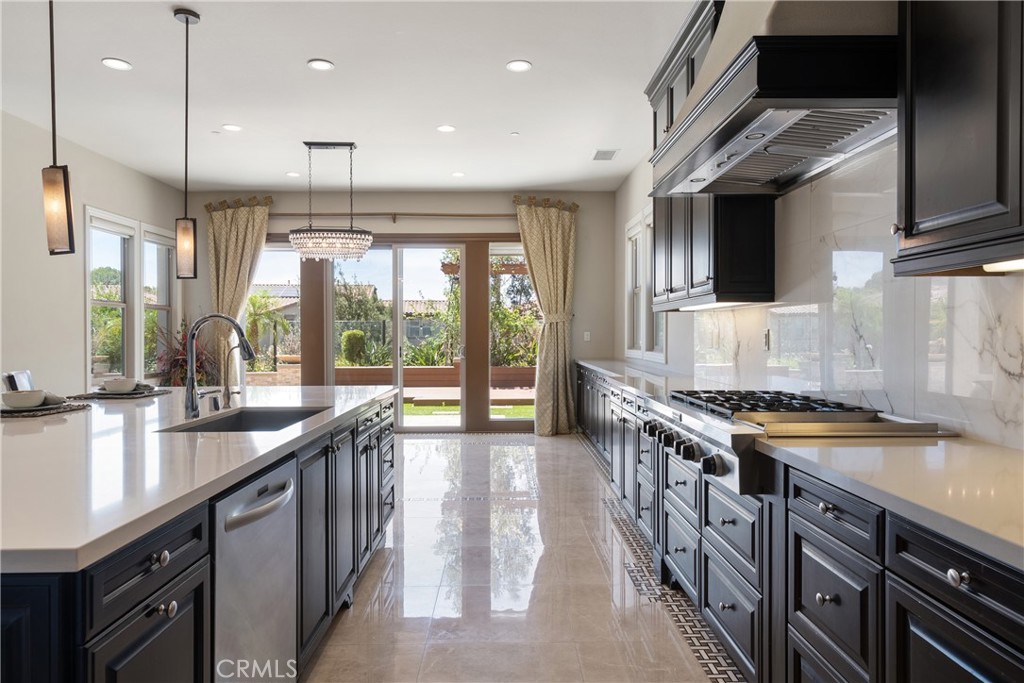 2498 Santa Paula Drive Brea, CA 92821 - Photo 21 of 75 a kitchen with stainless steel appliances granite countertop a stove a sink and a refrigerator