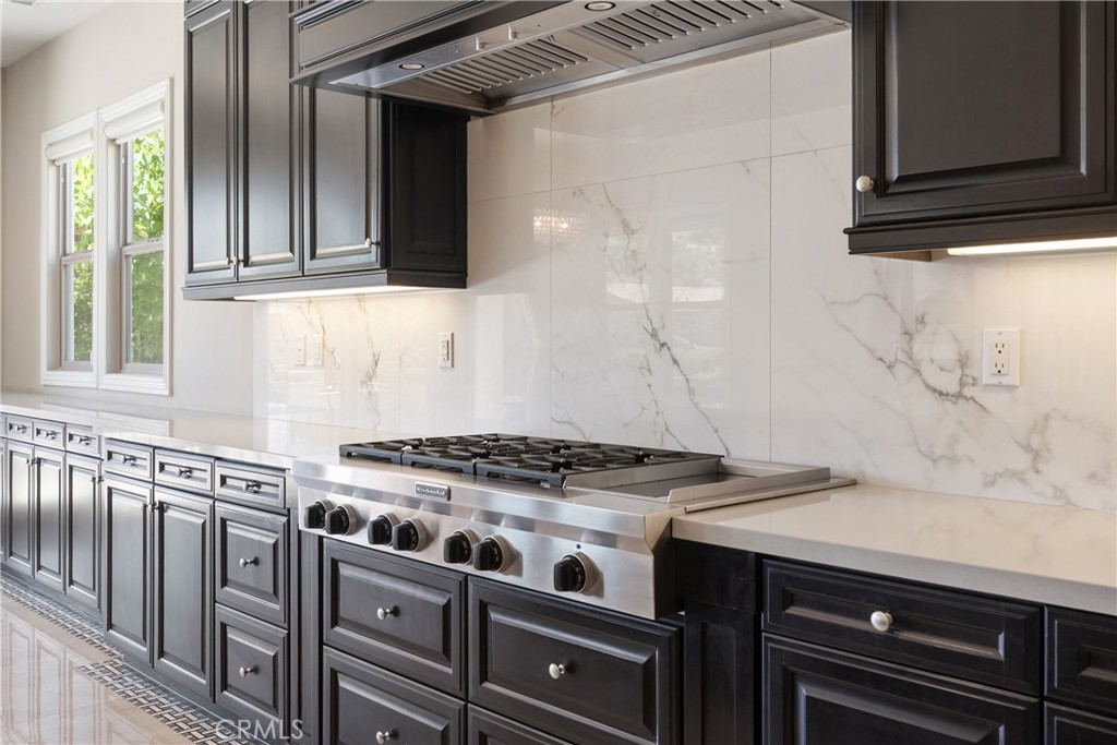 2498 Santa Paula Drive Brea, CA 92821 - Photo 23 of 75 a kitchen with granite countertop a stove and a sink