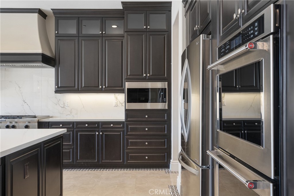 2498 Santa Paula Drive Brea, CA 92821 - Photo 25 of 75 a kitchen with stainless steel appliances granite countertop a refrigerator and a sink