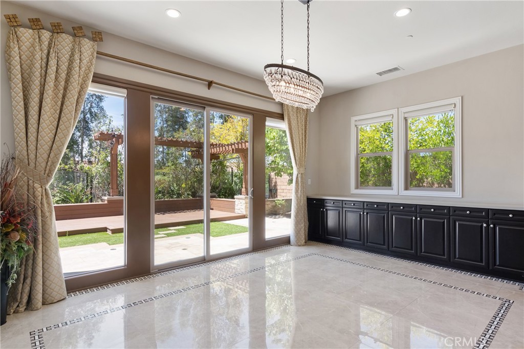 2498 Santa Paula Drive Brea, CA 92821 - Photo 29 of 75 a view of a room with a large window and chandelier