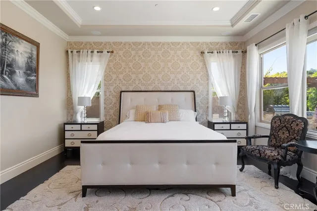 a bedroom with a large bed and a dresser