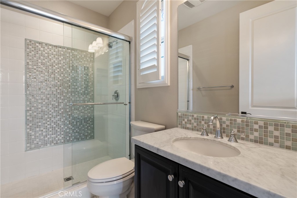 2498 Santa Paula Drive Brea, CA 92821 - Photo 58 of 75 a bathroom with a granite countertop sink toilet and shower