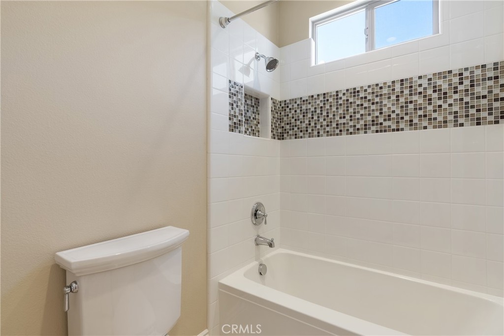 2498 Santa Paula Drive Brea, CA 92821 - Photo 63 of 75 a bathroom with a bathtub and a toilet