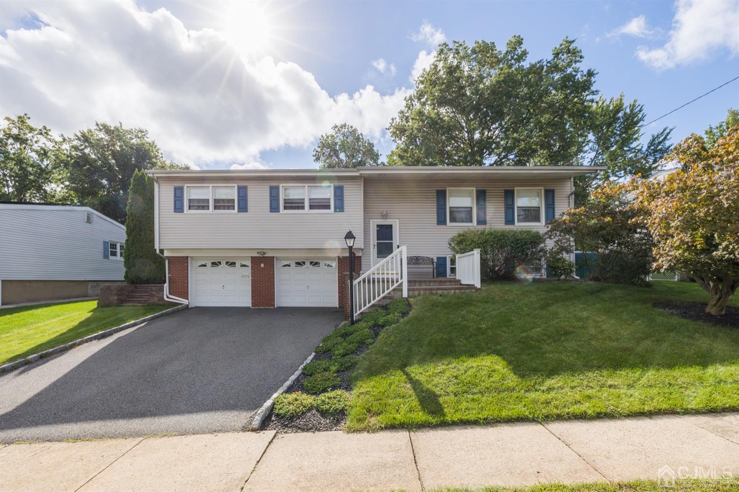 8 Wilk Road Edison, NJ 08837 - Photo 1 of 20 a view of a house with a yard and a large tree