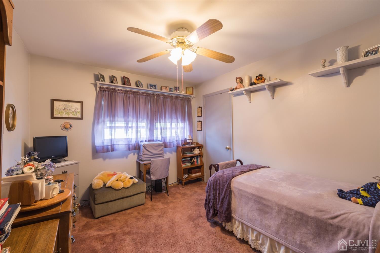 8 Wilk Road Edison, NJ 08837 - Photo 11 of 20 a bedroom with bed and a window