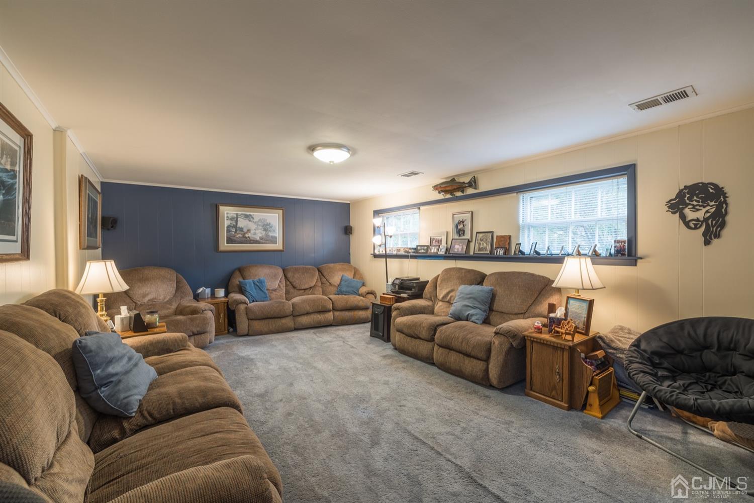8 Wilk Road Edison, NJ 08837 - Photo 17 of 20 a living room with furniture and a large window