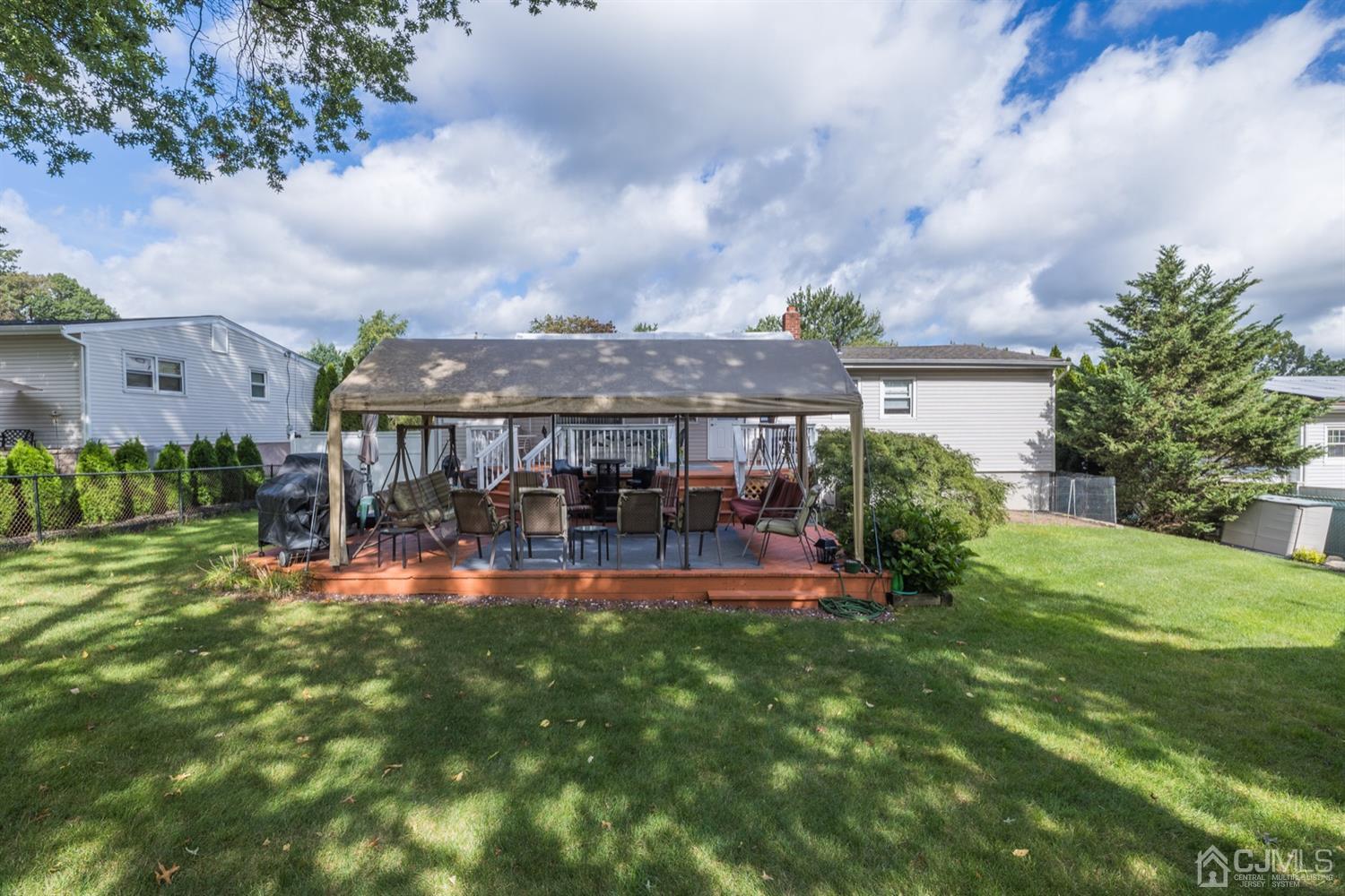 8 Wilk Road Edison, NJ 08837 - Photo 4 of 20 a view of a house with a yard and sitting area