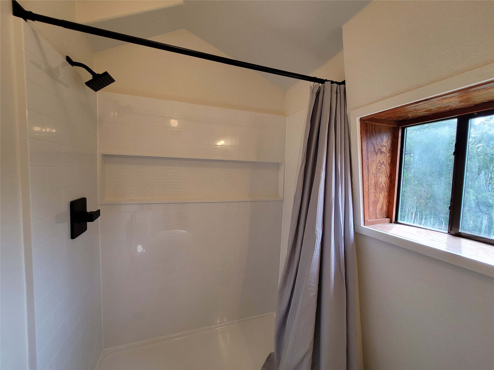 281 Earl Callahan Road, Unit A Cedar Creek, TX 78612 - Photo 30 of 39 a bathroom with a shower