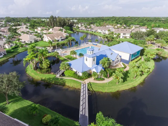an aerial view of residential house with outdoor space and lake view