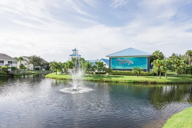 a view of a lake with houses in the back
