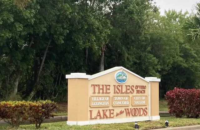 a sign that is on a pole on a street