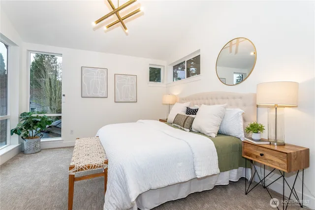 a bed room with a bed and a chair