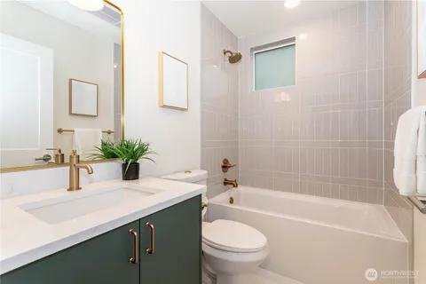 a view of a dining room with furniture and a window