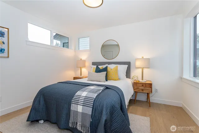 a bedroom with a bed and night stand