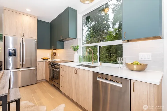 a kitchen with a sink and a refrigerator