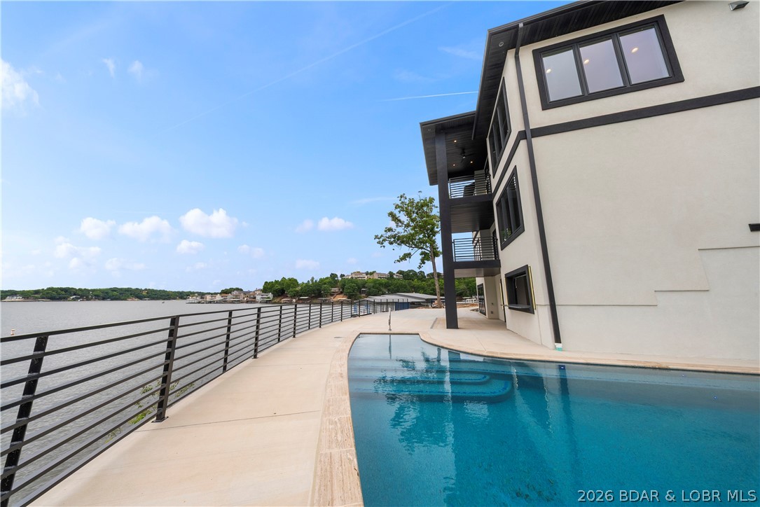 439 Red Bud Road Lake Ozark, MO 65049 - Photo 88 of 98 Expansive pool deck with unobstructed lake views a