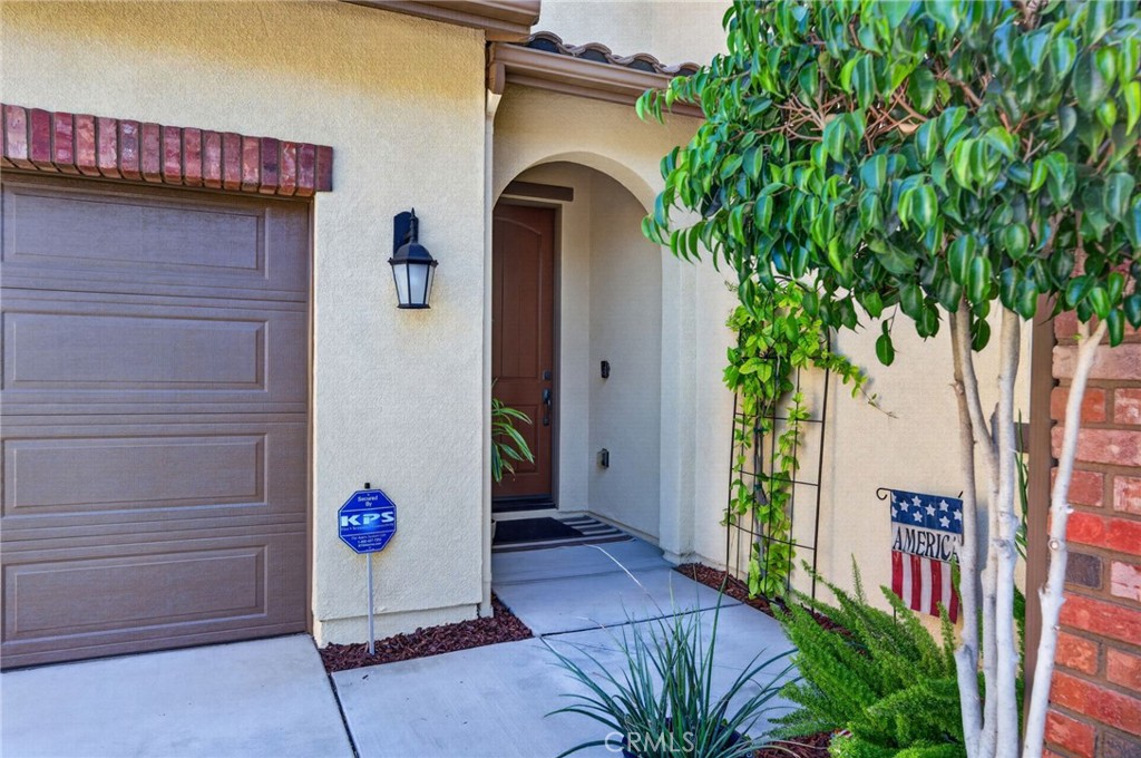 31749 Country View Road Temecula, CA 92591 - Photo 5 of 68 a front view of a house with a garden