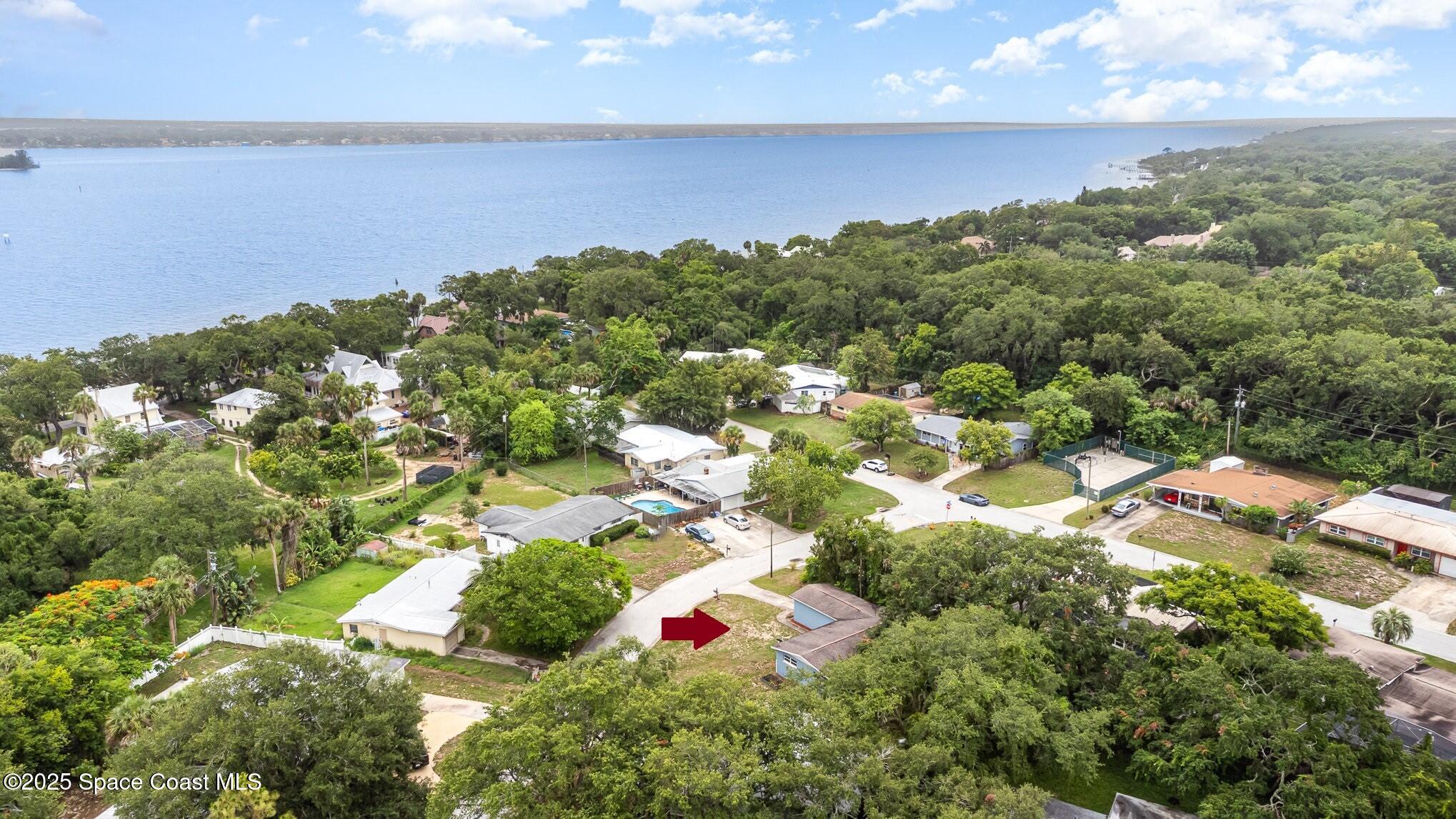 13 Scott Lane Rockledge, FL 32955 - Photo 2 of 26 an aerial view of residential houses with outdoor space and trees all around