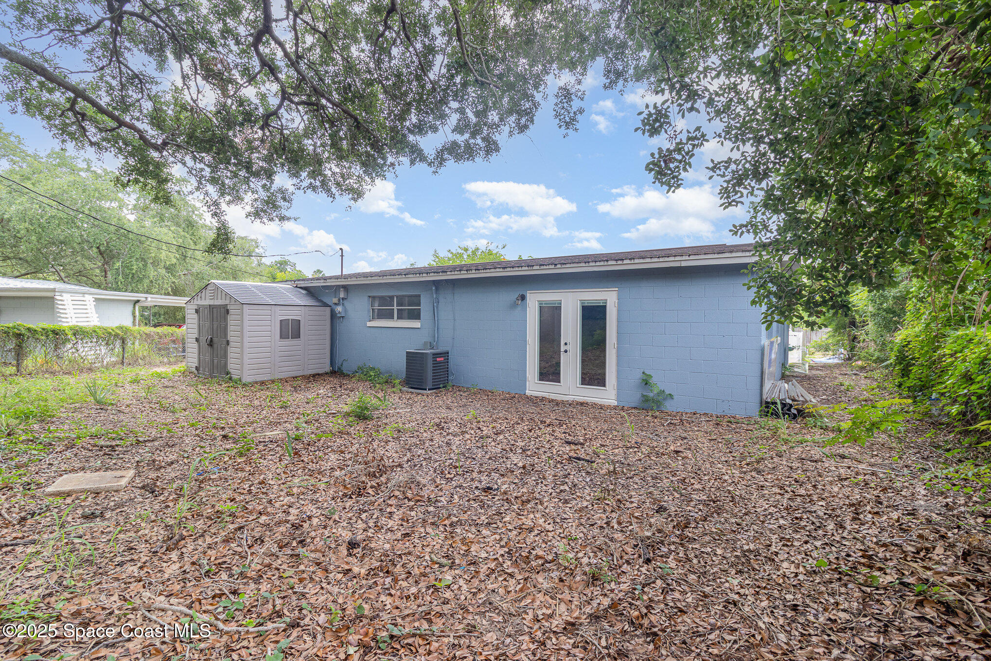 13 Scott Lane Rockledge, FL 32955 - Photo 21 of 26 a backyard of a house with lots of green space