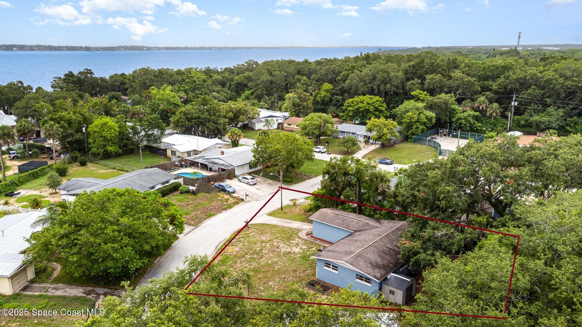 13 Scott Lane Rockledge, FL 32955 - Photo 25 of 26 an aerial view of residential houses with outdoor space and trees all around