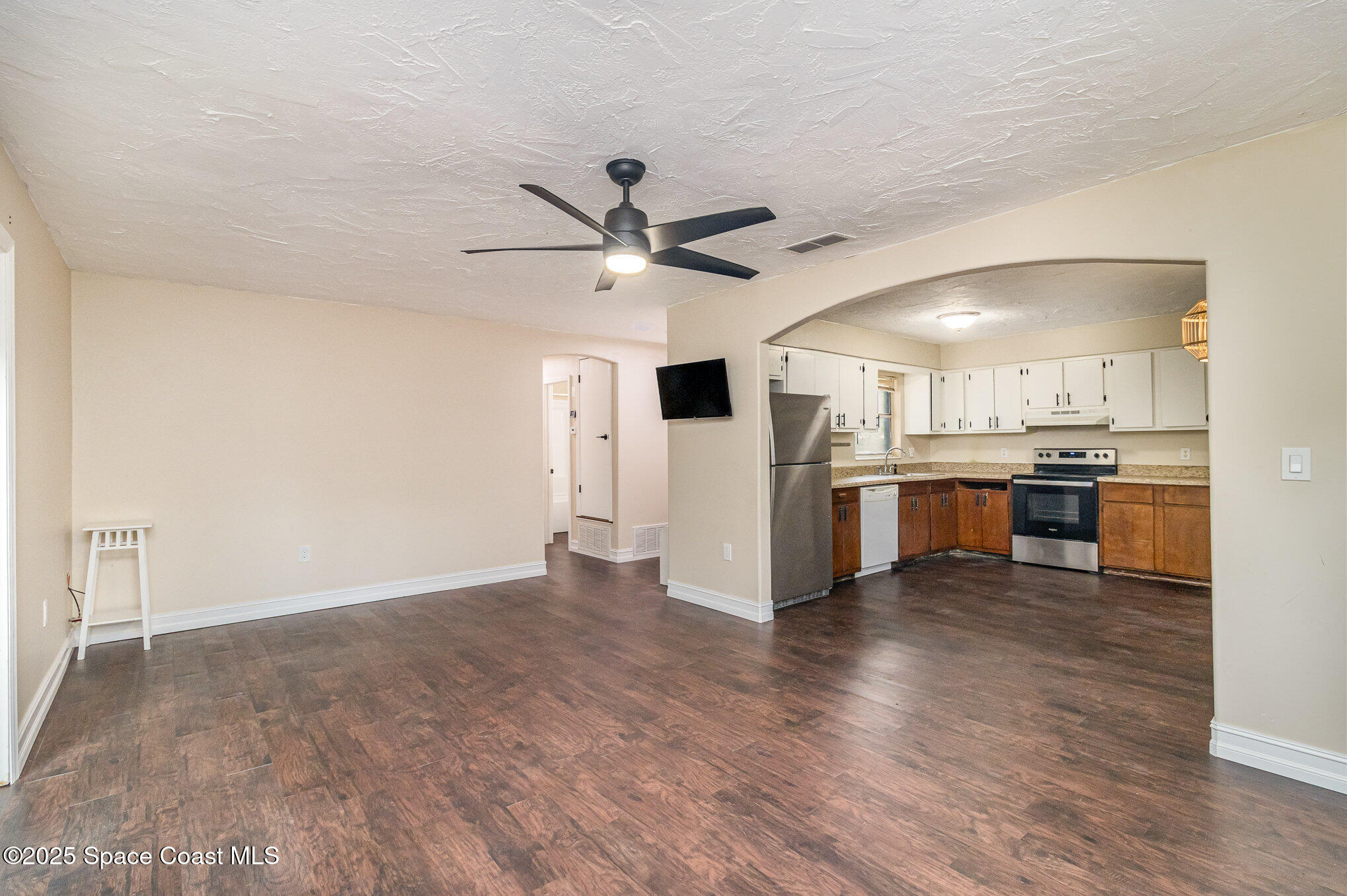 13 Scott Lane Rockledge, FL 32955 - Photo 4 of 26 a view of a kitchen with a sink and a stove top oven