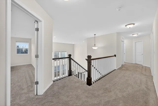 a view of a hallway with staircase