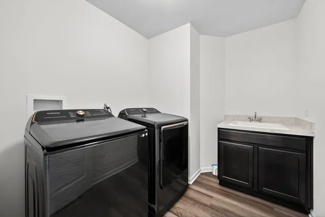 a utility room with dryer and washer