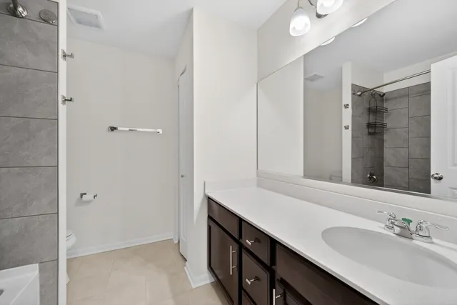 a bathroom with a double vanity sink a and mirror