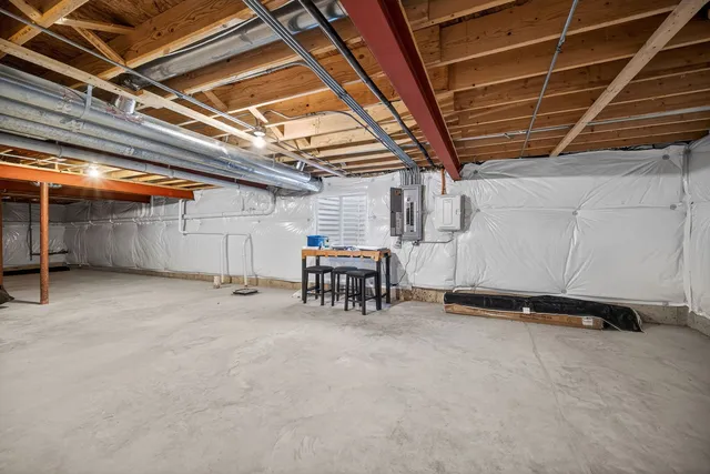 a view of empty room with wooden ceiling