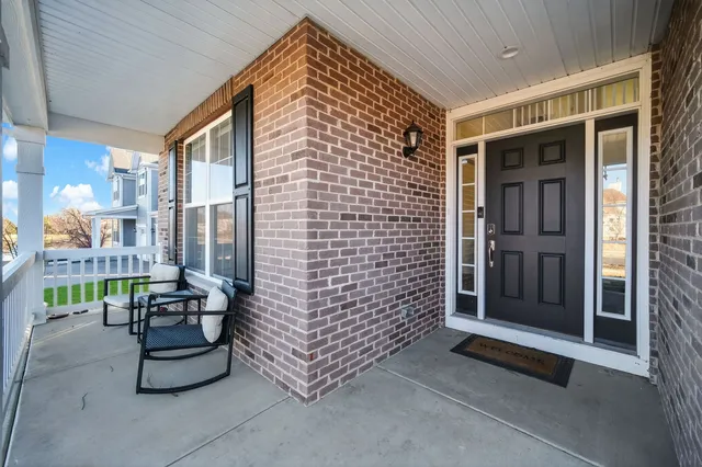 a balcony with furniture and a window
