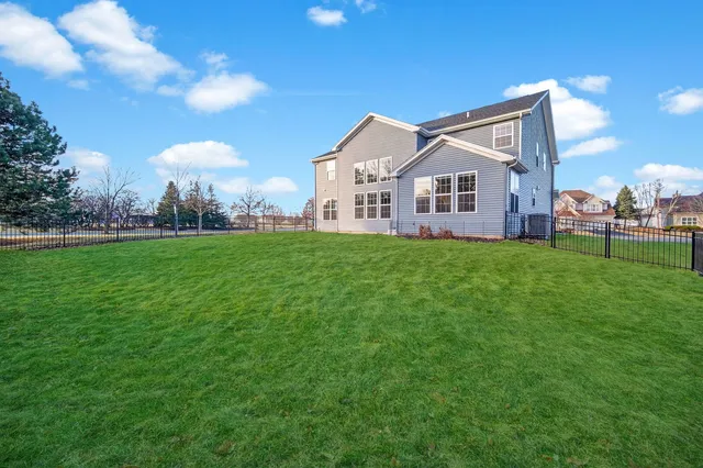 a big house with a big yard and more windows