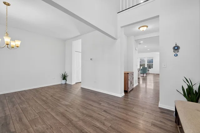 a view of a big room with wooden floor and a bathroom
