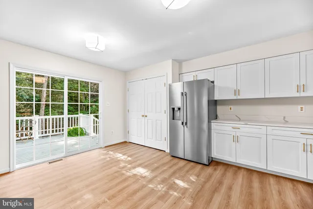 a view of a kitchen with a stove cabinets and a wooden floor