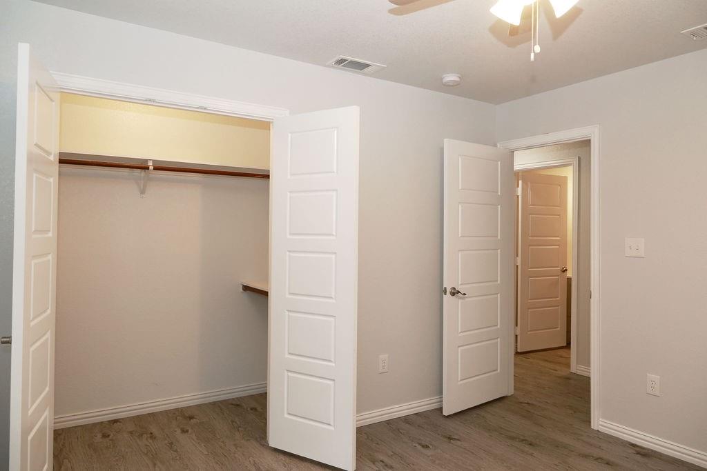 7311 Farm To Market Road 1886, Unit 101 Azle, TX 76020 - Photo 17 of 37 wooden floor in an empty room