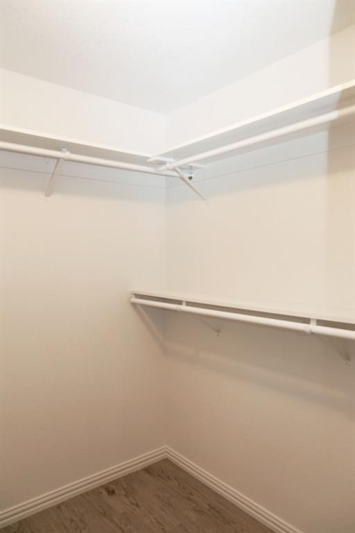 7311 Farm To Market Road 1886, Unit 101 Azle, TX 76020 - Photo 21 of 37 a view of a room with racks on the wall