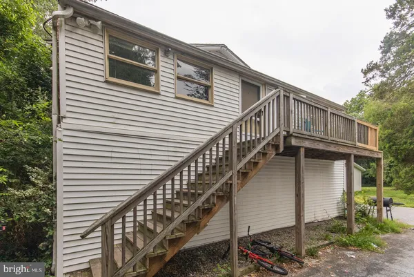 a view of a house with wooden stairs