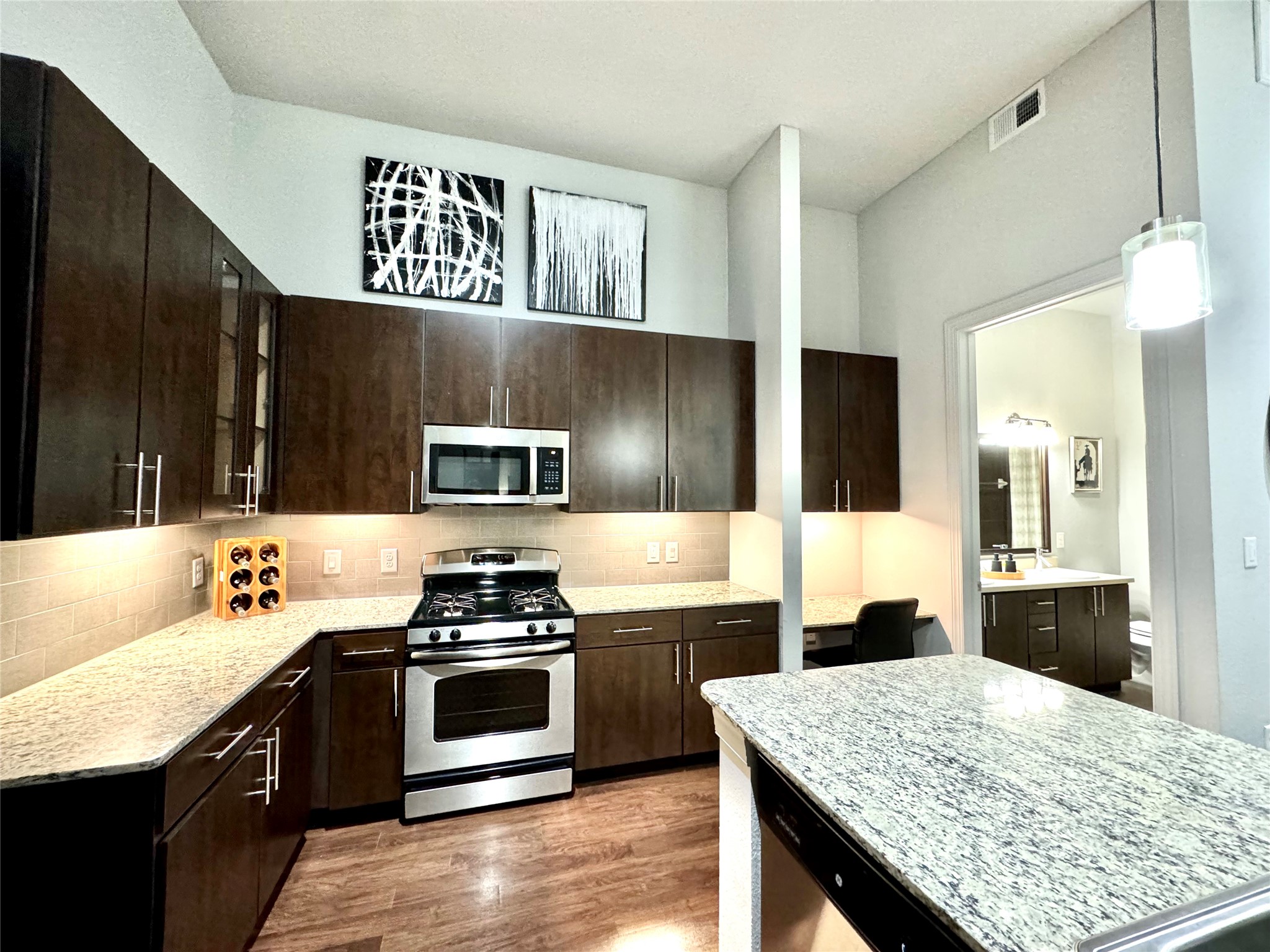 2525 McCue Road, Unit 249 Houston, TX 77056 - Photo 12 of 13 a kitchen with a stove and a sink