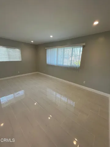 a view of an empty room with a windows