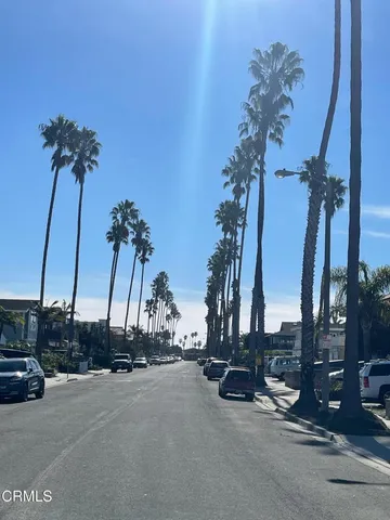 a view of a street with cars