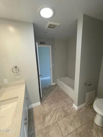 a bathroom with a sink and a toilet