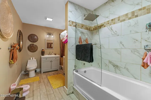 a bathroom with a sink a bathtub and a toilet