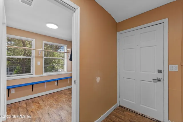 a view of a room that has a window in it